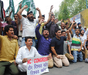 PDP activists raising slogans during protest at Jammu on Wednesday.