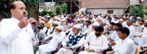 Cong leader Abdul Gani Vakil addressing party workers at Sopore on Monday.