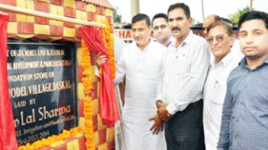 Minister for PHE Sham Lal Sharma laying foundation stone of Daskal model village in Akhnoor.