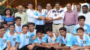 Young footballers posing alongwith the dignitaries during prize distribution function at DPS Katra on Wednesday.