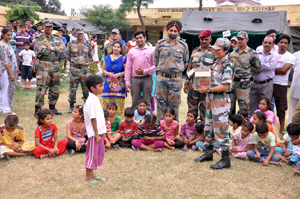 Army officers supervise arrangements at migrant camp at Salehar in Arnia sector on Thursday.