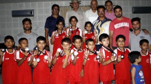 Young fencers of the State display the medals won in the Mini National Championship at Jammu on Monday.