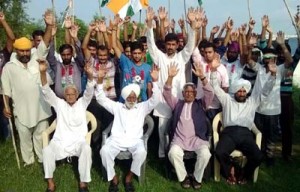 Congress activists shouting slogans during a protest demonstration at Gurha Morh on Thursday.