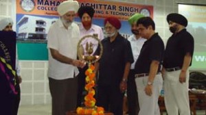 Dignitaries lighting ceremonial lamp while inaugurating Orientation-cum-Induction Programme at MBS College of Engineering and Technology.
