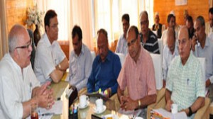 Minister for CAPD Ch Mohd Ramzan and Minister for R&B, Abdul Majid Wani chairing a meeting at Srinagar on Thursday.