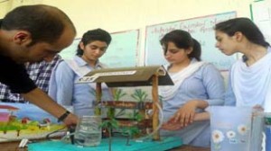 Students displaying models during Inspire Award Science Exhibition at Rajouri on Tuesday.