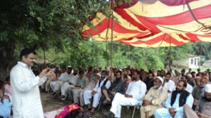 Javed A Rana addressing a public meeting at Mankote on Friday.