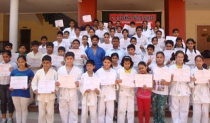 Judokas of GD Goenka Public School displaying certificates while posing for a group photograph on Saturday.