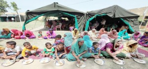 Border migrants take food provided by the Army in a relief camp at Salehar, Arnia on Tuesday. Another pic on page 6.  -Excelsior/Rakesh