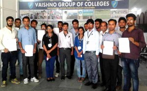 Students posing for a group photograph during placement drive at Vaishno College of Education.