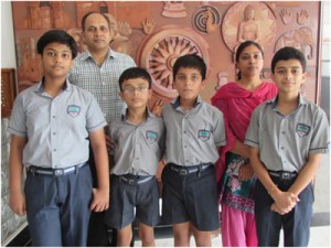 Winners of Wild Wisdom Quiz City Level posing for a group photograph alongwith Principal Heritage School. 