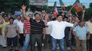 People protesting against power crisis in Sainik Colony on Tuesday.