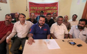 Senior SGEJAC member Sushil Sudan flanked by Suresh Sharma and Babu Hussain addressing press conference in Jammu. -Excelsior/ Rakesh