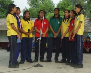 Students presenting group song during Sanskrit Week at KV Jindrah.