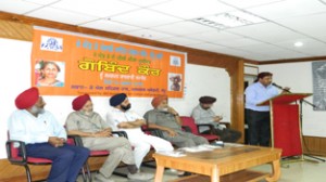 A poet reciting his poem during a programme organized by JKPSS to pay tributes to woman sculptor, Gobind Kaur.