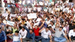 Daily rated and CP workers of PHE Deptt staging protest dharna at B C Road complex in Jammu on Wednesday.  -Excelsior/ Rakesh 