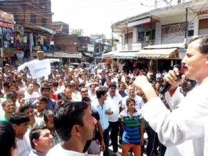 Balwant Singh Mankotia addressing party workers during a protest demonstration at Udhampur on Sunday.