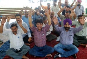 Members of clerical staff sitting on protest dharna at DC office in Jammu on Friday. -Excelsior/Rakesh