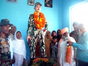 People paying tributes to martyr Ami Chand on his death anniversary at village Pakhari in district Samba.