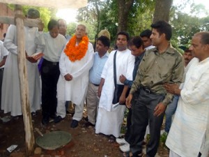 Janak Raj Gupta laying foundation stone of public bathroom at Christian graveyard on Monday.