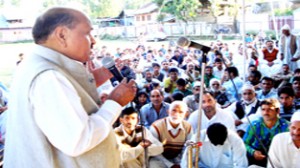 Congress leader Abdul Gani Vakil addressing public gathering at Balhama in Rafiabad on Tuesday.