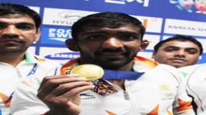 India's Wrestler Yogeshwar Dutt with his men's 65kg freestyle gold medal at the 2014 Asian Games in Incheon on Sunday. (UNI) 