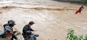 Troops rescue people using rope at Kanali Tibba in R S Pura sector on Tuesday. -Excelsior/Rakesh
