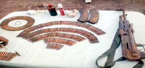 Arms and ammunition seized by police and Army at Kandi, Rajouri on Sunday.