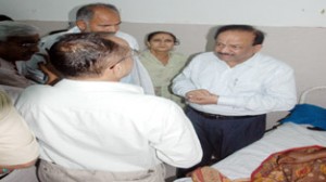Union Health Minister Dr Harsh Vardhan interacting with attendants of rain-hit injured persons at Poonch Hospital on Saturday.  -Excelsior/Harbhajan