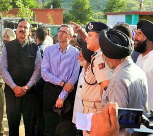 Chief Minister Omar Abdullah inspecting flood hit areas in Rajouri on Monday. Another pic on page 6.