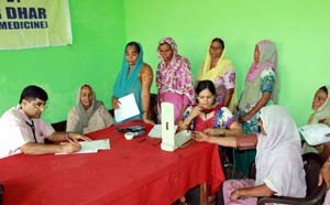 Dr Anil Dhar examining the patients during the free medical camp for Hypertension and Diabetes on Saturday.