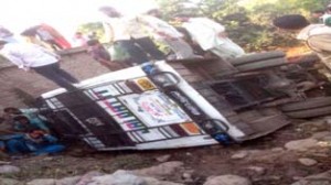 People removing trapped injured persons from mini-bus which rolled down near Nagrota in Rajouri on Thursday. -Excelsior/ Bhat