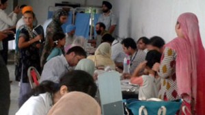 HoD Cardiology, GMC Jammu examining patients at a free medical camp in Simbal Camp on Sunday.