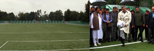 A view of Synthetic Turf Football Stadium (L) Chief Minister Omar Abdullah testing football skills while inaugurating the stadium.