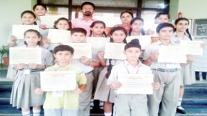 Winners of Hindi Essay Writing Competition posing for a photograph at KCIS in Jammu.