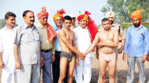 Former Minister R S Chib felicitating wrestlers at Satrayian in RS Pura.