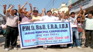 Sunil Dimple, president, Jammu West Assembly Movement along with locals raising slogans in support of their demands on Monday.