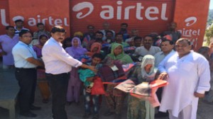 Senior BJP leader, Pawan Gupta distributing relief material among the flood affected families at Mand Panchayat of Udhampur district.