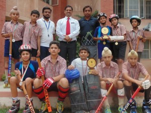 Skaters of Jodhamal Public School posing alogwith Principal of the School, Trilok Singh Bist and coaches.