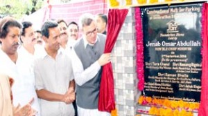Chief Minister, Omar Abdullah laying foundation stone of multi-tier parking at Jammu on Tuesday.