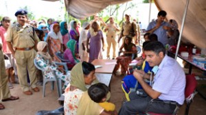 DIG Jammu Shakeel Ahmed Beig during medical camp at Bhagatpur Sandhwan in Pouni Chak area.