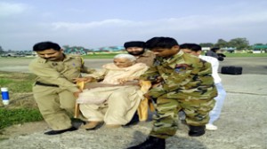 An old woman, who was trapped in flood affected area, at Jammu Technical Airport. -Excelsior/Rakesh