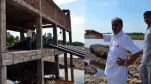 DyCM Tara Chand during visit to flood hit areas on Sunday.