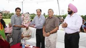 CUJ VC Prof Devanand being presented bouquet at the Foundation Day celebration function on Wednesday.