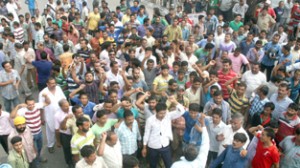 People protesting against non-availability of power and water at Satwari on Thursday.  -Excelsior/Rakesh