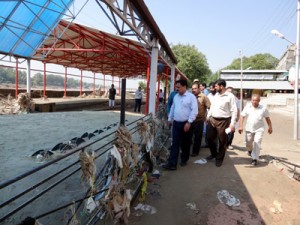 JMC Commissioner Kiran Wattal inspecting damages caused due to flash floods in Jammu on Monday.