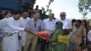 PDP leaders distributing relief at Saddal on Thursday. 