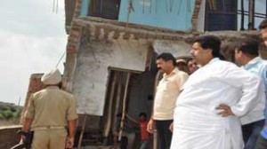 Minister for Housing, Raman Bhalla inspecting infrastructure damaged by rains on Saturday.
