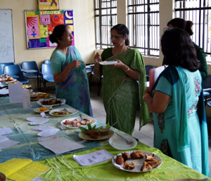 Food being tasted during celebration of National Nutrition Week at GCW Gandhi Nagar in Jammu.