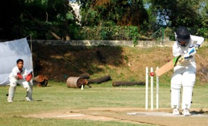Batsman trying to nudge the ball towards third-man area while wicketkeeper watches during a match of Col R N Chopra U-12 Challenge Cup in Jammu.        -Excelsior/Rakesh